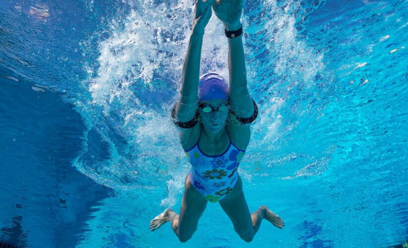Swimmer with KAATSU Aqua arms