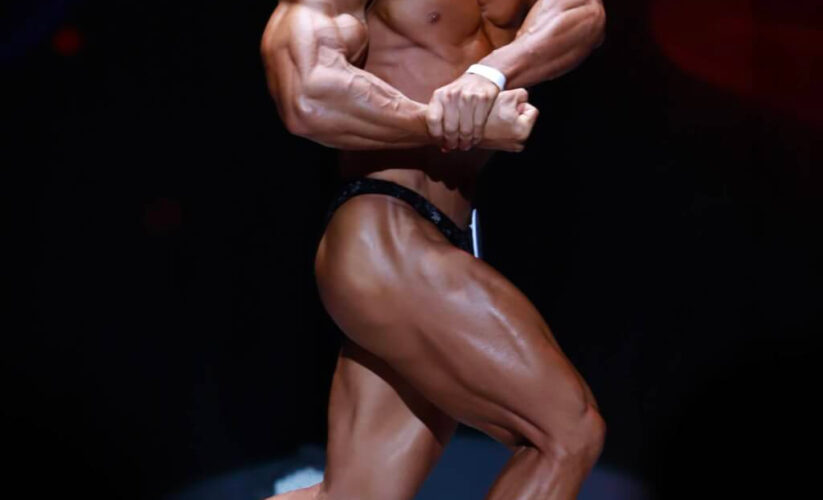 Bodybuilder posing in competition